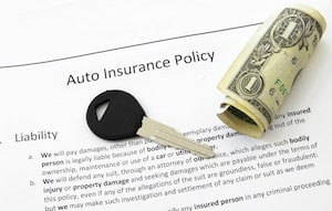 Auto Insurance Policy, Car Keys and Dollar
